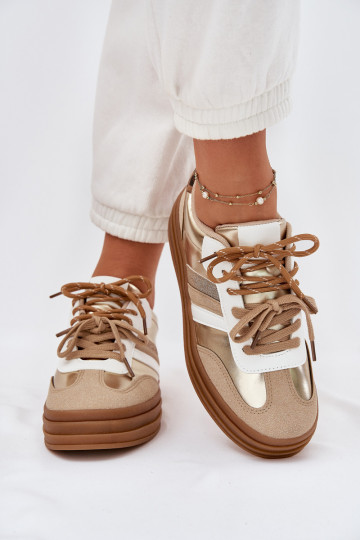 À modalo de tênis Feminino com uma plataforma Z PodParaójnym Amarrandom com padrões de pele de leopardo cor dourada Niteria 2