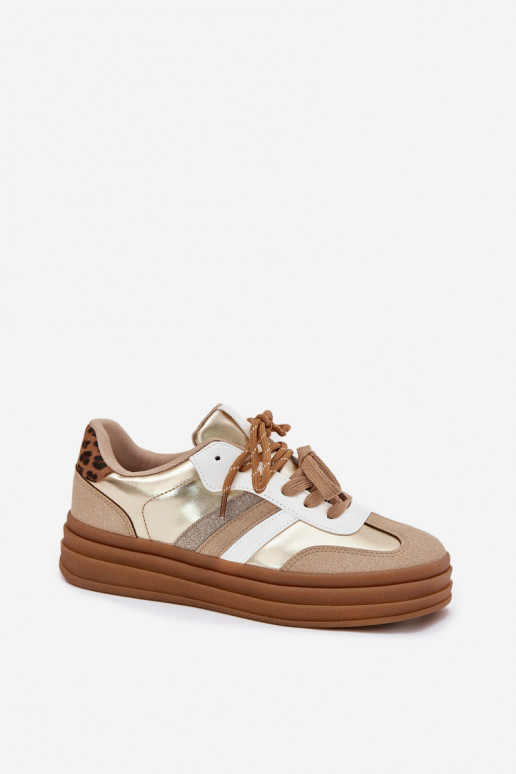 À modalo de tênis Feminino com uma plataforma Z PodParaójnym Amarrandom com padrões de pele de leopardo cor dourada Niteria À modalo de tênis Feminino com uma plataforma Z PodParaójnym Amarrandom com padrões de pele de leopardo cor dourada Niteria