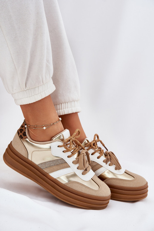 À modalo de tênis Feminino com uma plataforma Z PodParaójnym Amarrandom com padrões de pele de leopardo cor dourada Niteria À modalo de tênis Feminino com uma plataforma Z PodParaójnym Amarrandom com padrões de pele de leopardo cor dourada Niteria