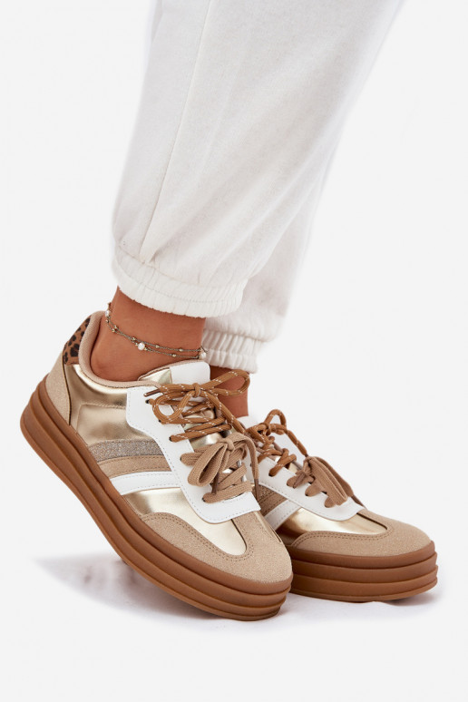 À modalo de tênis Feminino com uma plataforma Z PodParaójnym Amarrandom com padrões de pele de leopardo cor dourada Niteria À modalo de tênis Feminino com uma plataforma Z PodParaójnym Amarrandom com padrões de pele de leopardo cor dourada Niteria