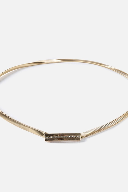 Pulseira elástica dourada com zircões...