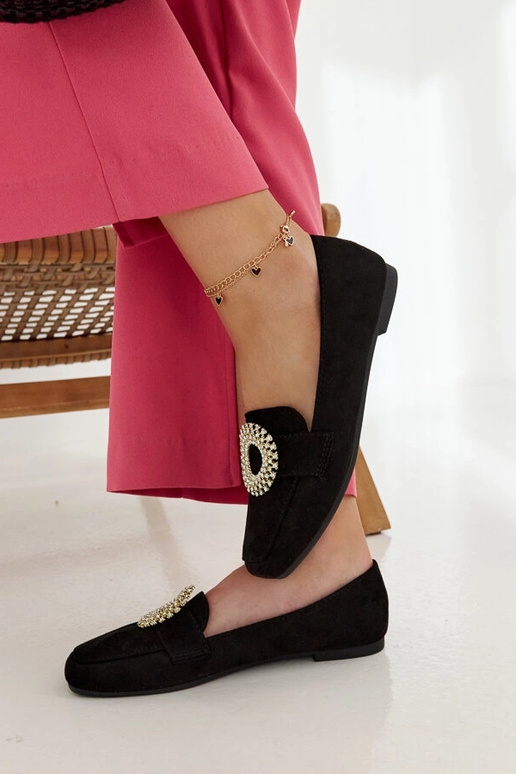 Mocassins pretos decorados com...