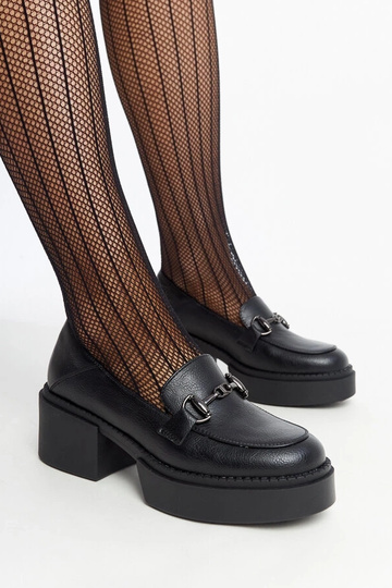 Sapatos de salto alto em...