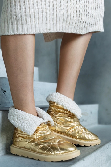 Botas de neve douradas...