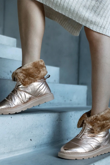 Botas de neve douradas...