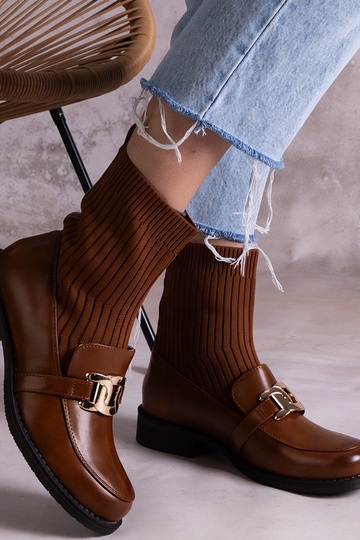 Botas de cano alto em...