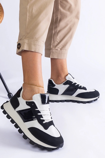 Tênis preto com protetor... 2