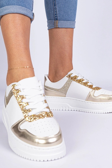 Tênis dourados femininos...