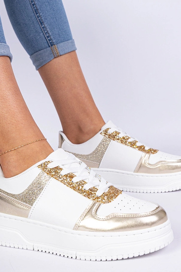 Tênis dourados femininos... 2