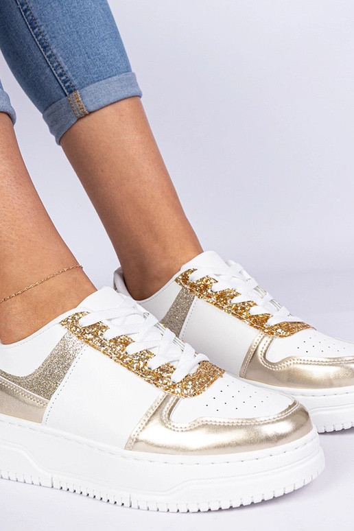 Tênis dourados femininos com solado...