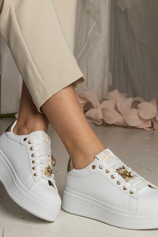 Ténis femininos brancos e dourados...