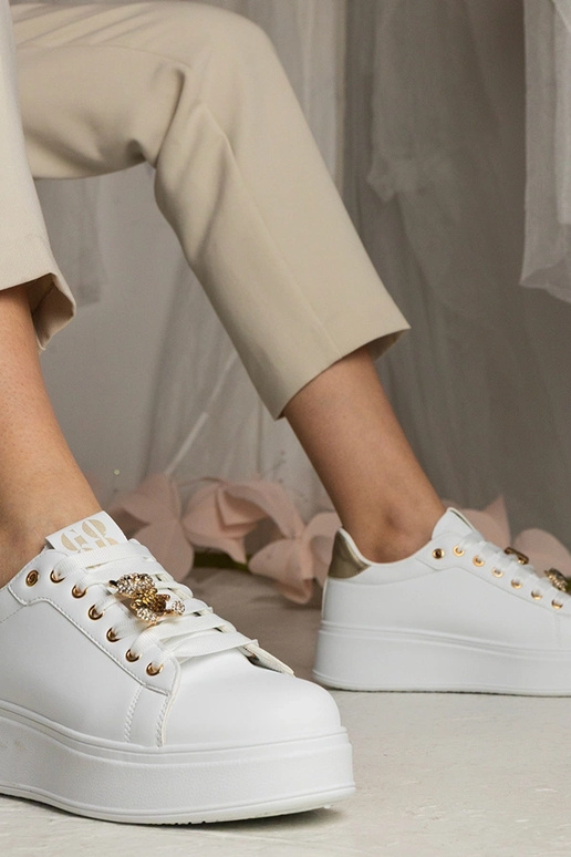 Ténis femininos brancos e dourados...