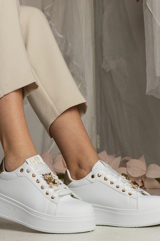 Ténis femininos brancos e dourados...