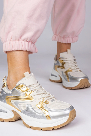 Ténis dourados com sola...