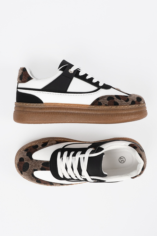 Tênis pretos e brancos estilo...