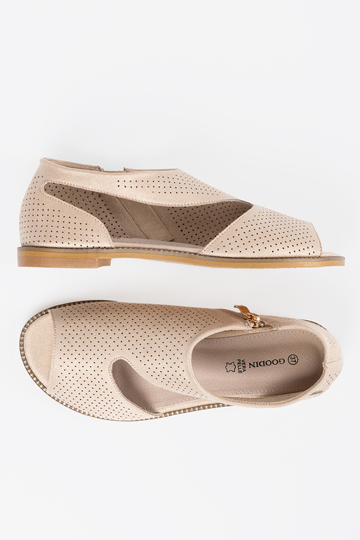 cor dourada sandálias a céu aberto em uma sola plana