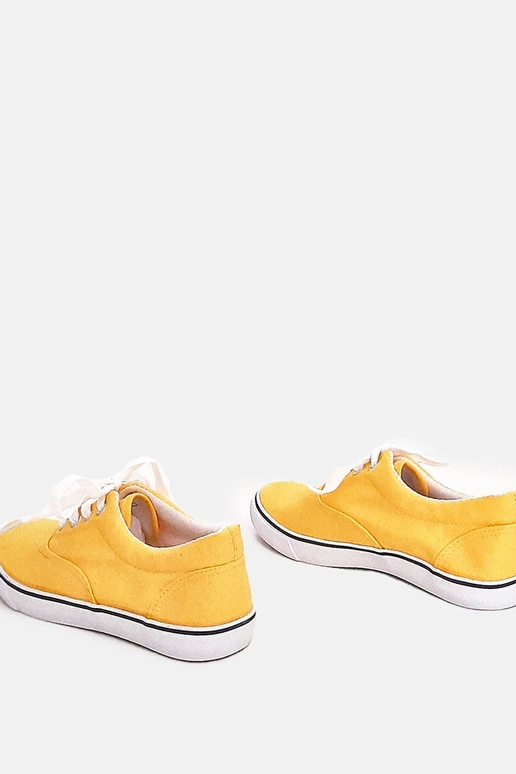 Tênis infantis amarelos com cadarços...