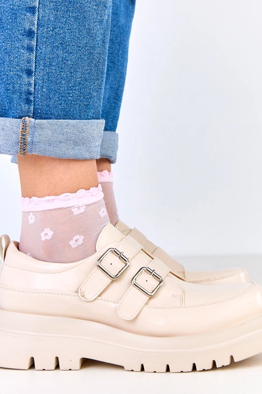 Botas de cano curto na cor areia em...