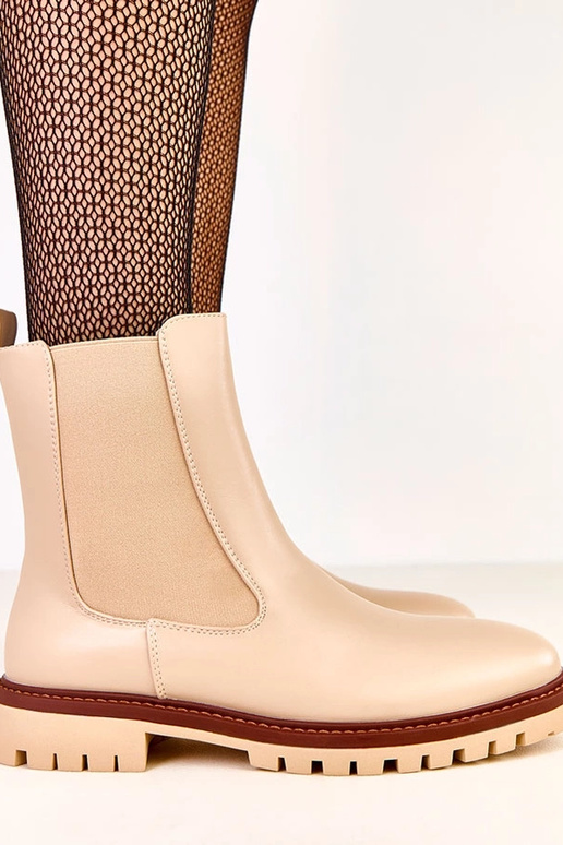 Botins bege com solado plano e... Botins bege com solado plano e...