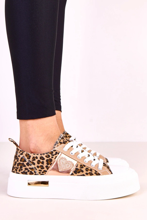 Tênis com estampa de leopardo em... Tênis com estampa de leopardo em...