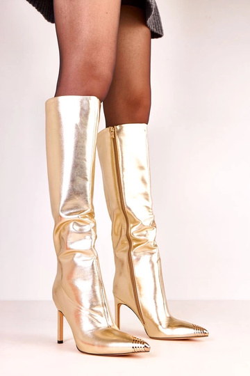 Botas elegantes douradas de...
