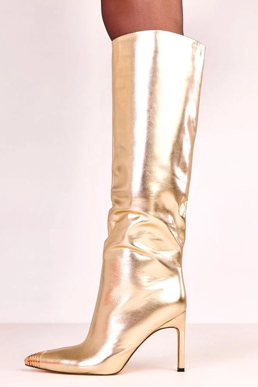 Botas elegantes douradas de cano...