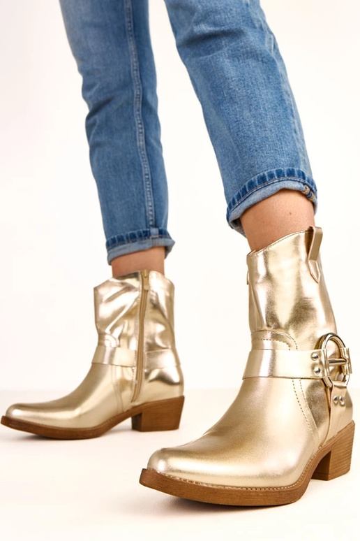 Botas cowboy douradas de salto com... Botas cowboy douradas de salto com...