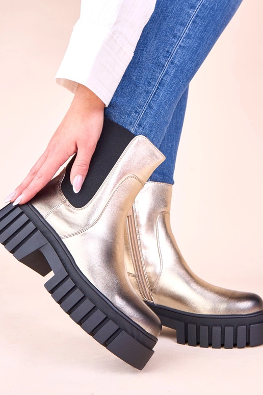Botas douradas em plataforma com...