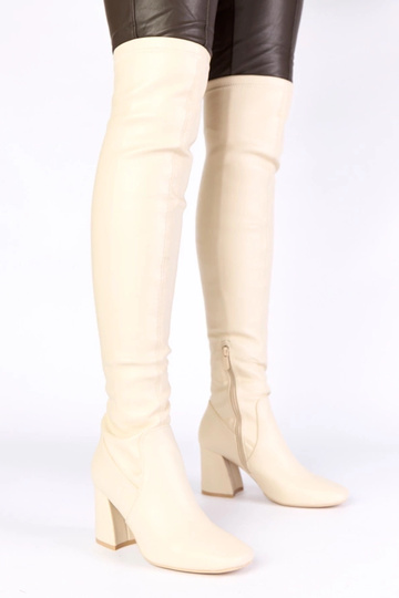 Botas de cano longo na cor...