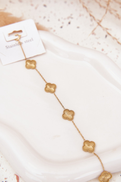 Um bracelete de aço inoxidávelcom motivos floraisuszkami cor dourada