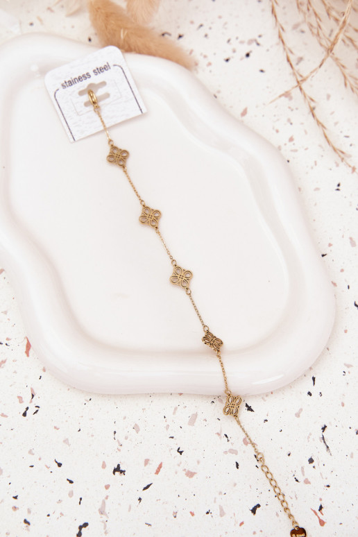 Um bracelete de aço inoxidável Com pingentes cor dourada