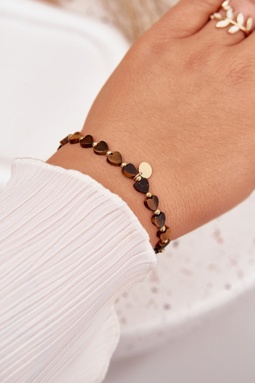 Um bracelete Corações Fabricado em aço cirúrgico Tem que serrrom