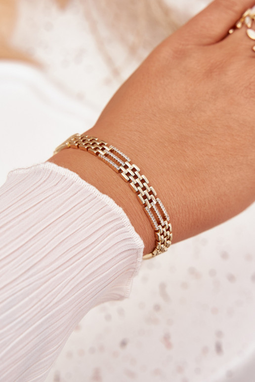 Um bracelete Feminino Fabricado em aço cirúrgico com olhos brilhantes cor dourada