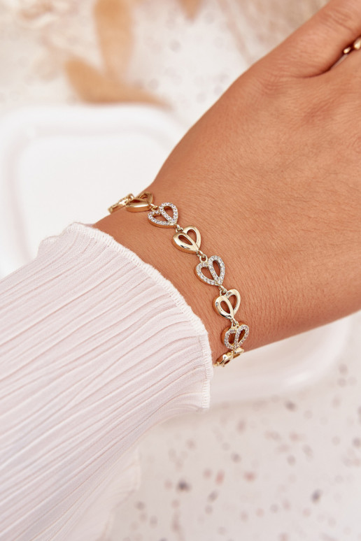 Um bracelete Fabricado em aço cirúrgico com olhos brilhantes cor dourada