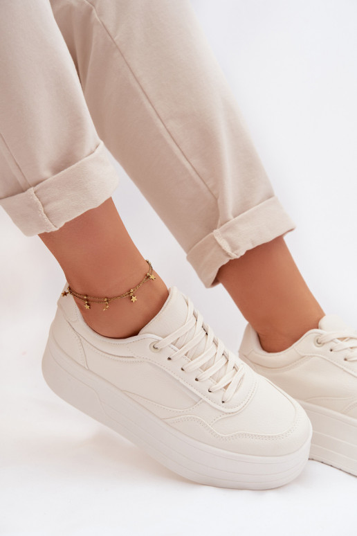 À modalo de tênis Feminino com uma plataforma cor de marfim Feressa