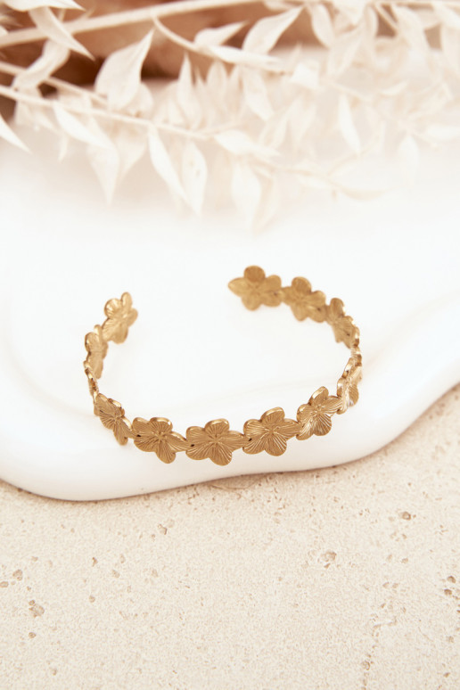 Um bracelete Feminino de aço inoxidável com motivos floraisuszki cor dourada