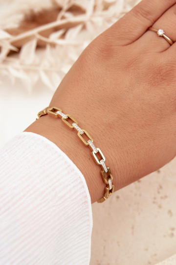 Um bracelete Feminino Decorado com zircônias cúbicas cor dourada