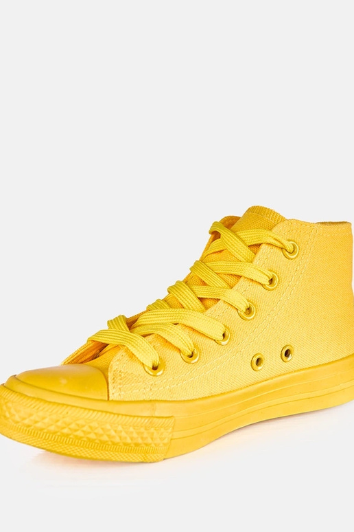 Tênis amarelos infantis acima do...