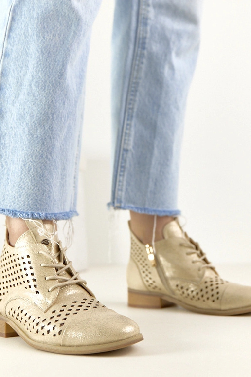 Botins perfurados dourados Potocki
