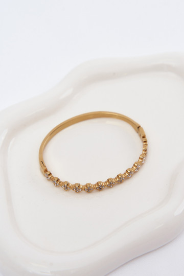 Pulseira dourada feminina com pedras brilhantes