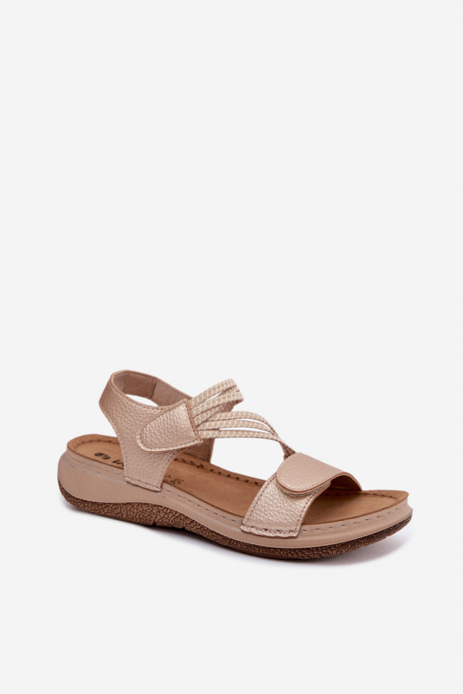 Sandálias douradas femininas com tiras elásticas