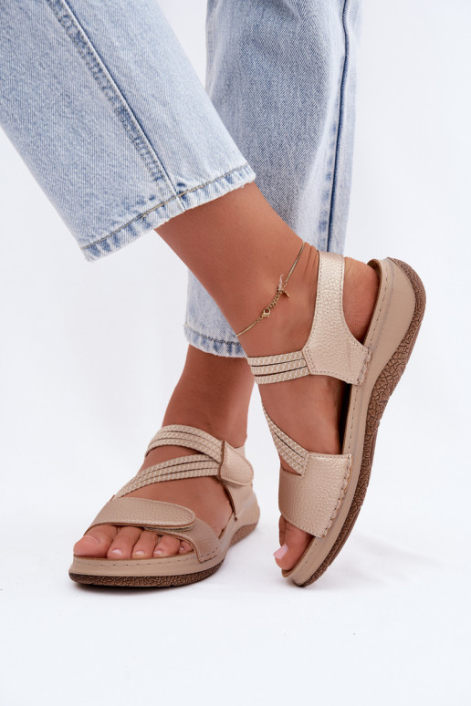 Sandálias douradas femininas com tiras elásticas