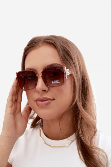 Óculos de sol com detalhes decorativos na cor rosa
