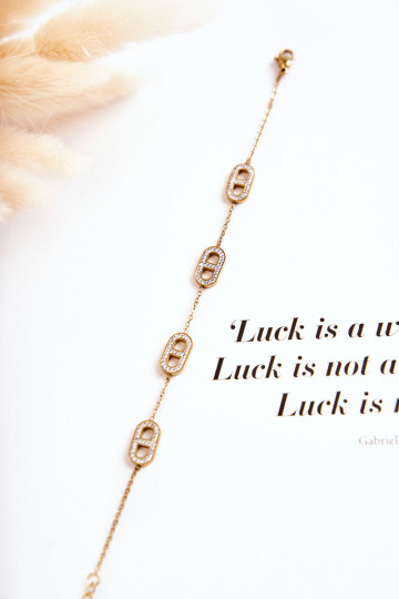 Pulseira feminina com olhos brilhantes na cor dourada