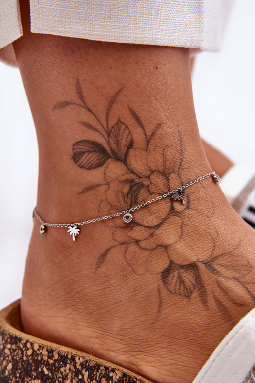 Pulseira de perna prateada com olhos brilhantes