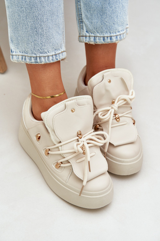 À modalo de tênis Feminino com uma plataforma bege Dolistana