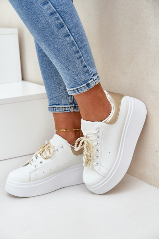 À modalo de tênis Feminino com uma plataforma com lindos detalhes Branco-cor dourada Lerissna