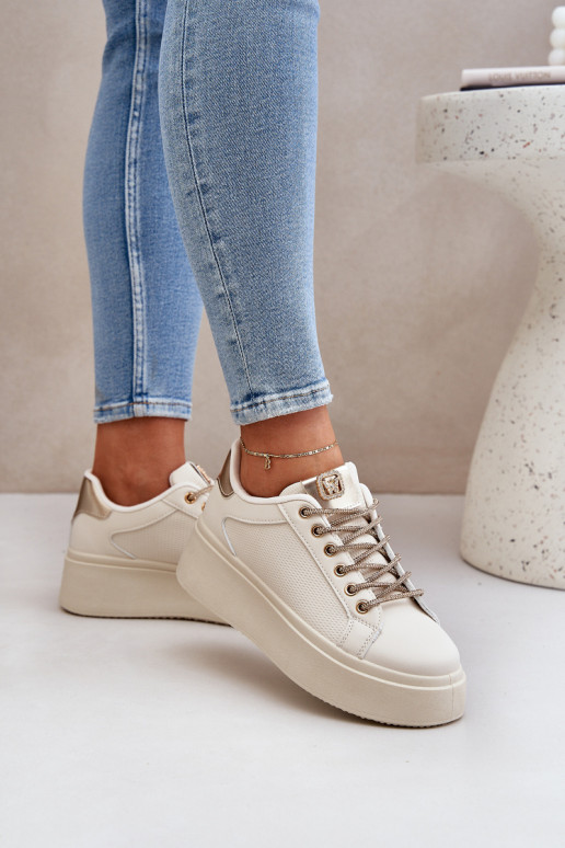 À modalo de tênis com uma plataforma Com decoraçõesi SznuróParakami bege Fonetha À modalo de tênis com uma plataforma Com decoraçõesi SznuróParakami bege Fonetha