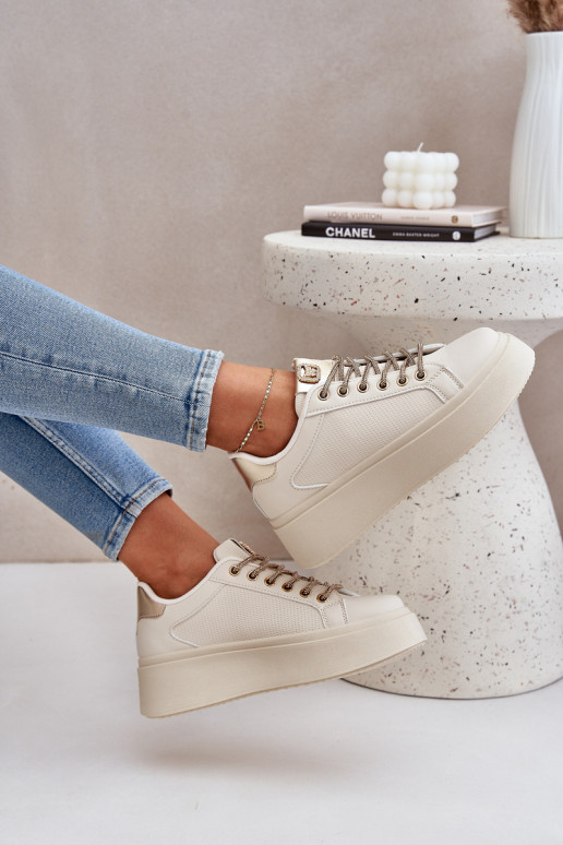 À modalo de tênis com uma plataforma Com decoraçõesi SznuróParakami bege Fonetha À modalo de tênis com uma plataforma Com decoraçõesi SznuróParakami bege Fonetha