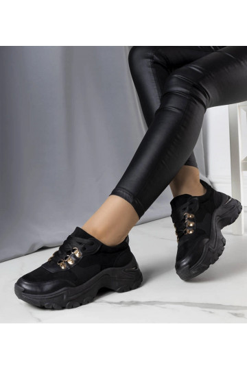 Tênis preto em materiais... 2